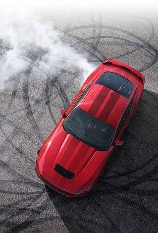 Overhead view of a 2024 Ford Mustang® model with tire tracks on pavement | Herb Green Ford, Inc. in Cascade IA