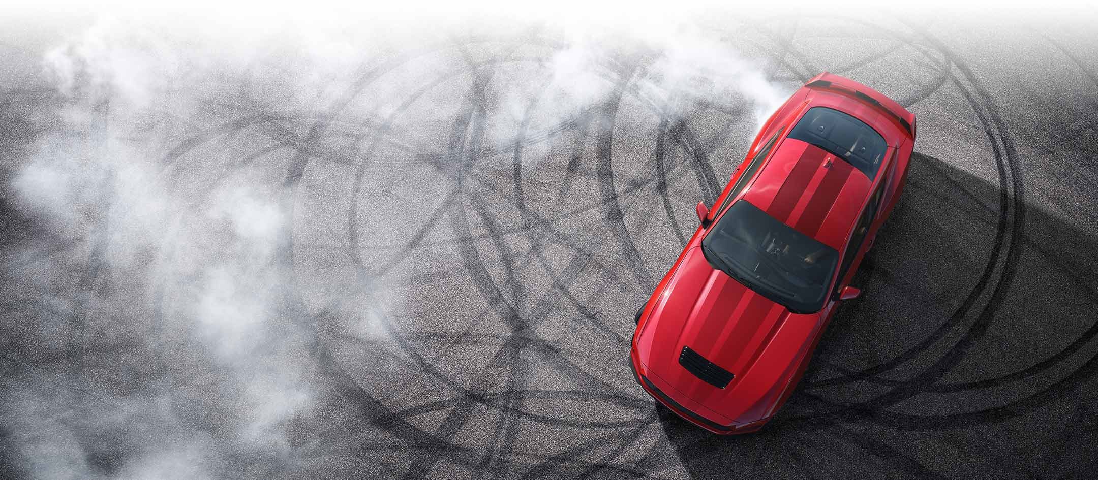 Overhead view of a 2024 Ford Mustang® model with tire tracks on pavement | Herb Green Ford, Inc. in Cascade IA