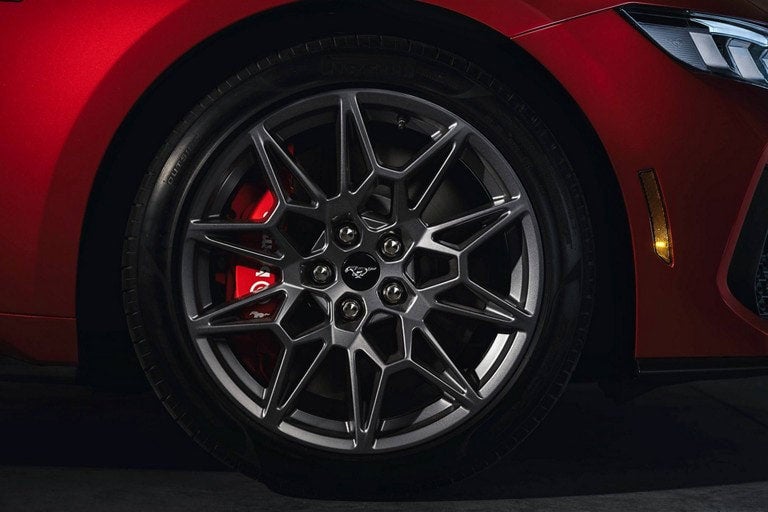 2024 Ford Mustang® model with a close-up of a wheel and brake caliper | Herb Green Ford, Inc. in Cascade IA
