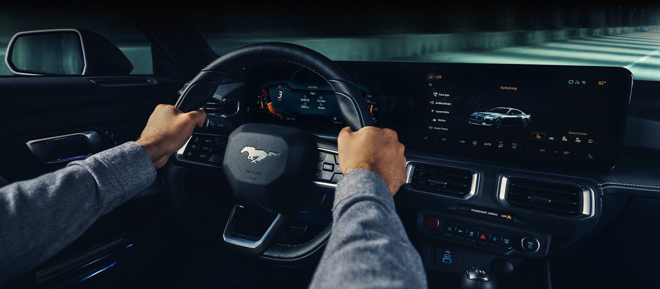 A 2024 Ford Mustang® model interior with a person driving | Herb Green Ford, Inc. in Cascade IA